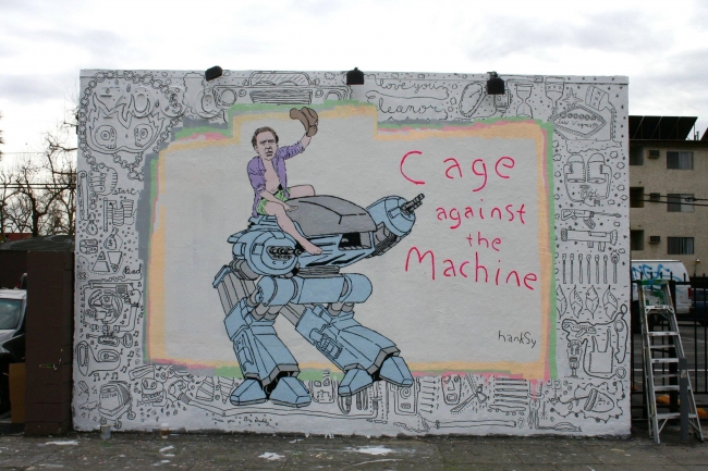 Cage against the Machine, by Hanksy